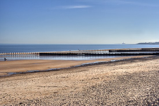 View along Blyth South Beach towards Seaton Sluice and St. Mary's Island.