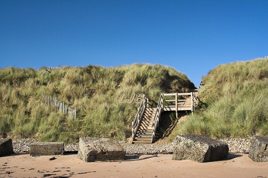 Steps up from the beach at Druridge Bay.