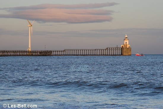 Fishing boat passing Blyth Lighthouse.