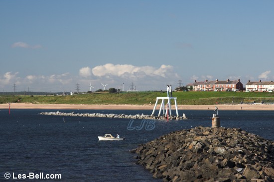 Breakwater and Couple Sculpture at Newbiggin, Northumberland.