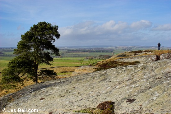 Lone figure on the top of Shaftoe Crags, Northumberland.