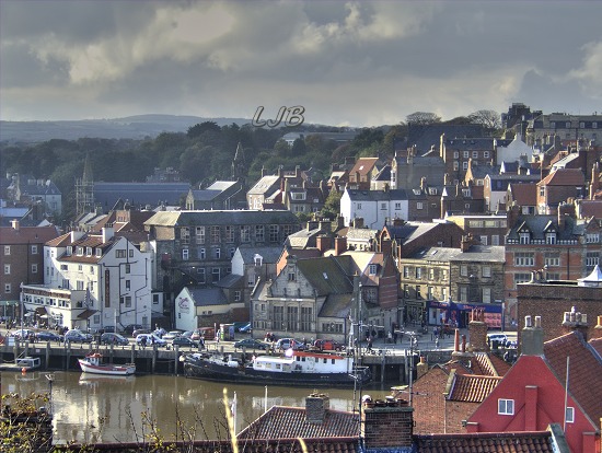 View over Whitby with stormy weather approaching from the moors.