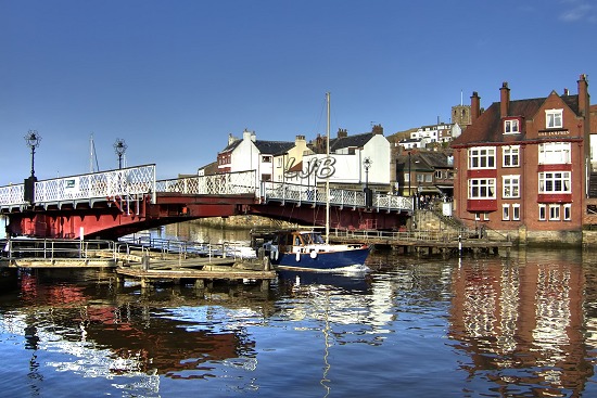 Whitby swing bridge opening for a yacht to pass through.