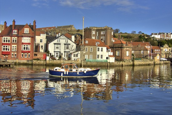Whitby swing bridge opening for a yacht to pass through.