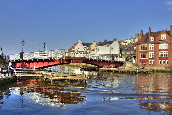 Whitby swing bridge opening for a yacht to pass through.