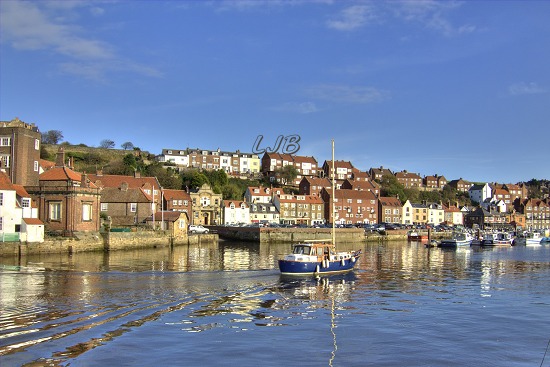 Whitby swing bridge opening for a yacht to pass through.