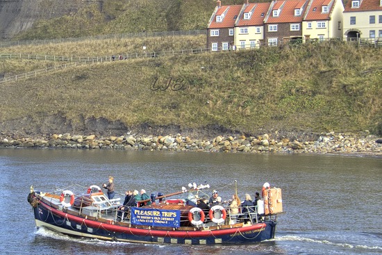 The old Whitby Lifeboat leaving on a cruise from the river.