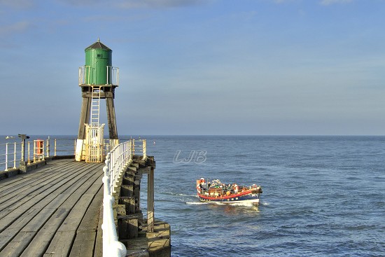 The old Whitby Lifeboat returning from a cruise.