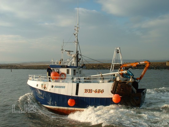 Fishing boat entering Amble Harbour.